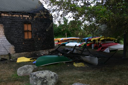 An early Friday morning fire on June 29 burned Osprey Kayak's shop and many of its boats. Photo by Jon Alden