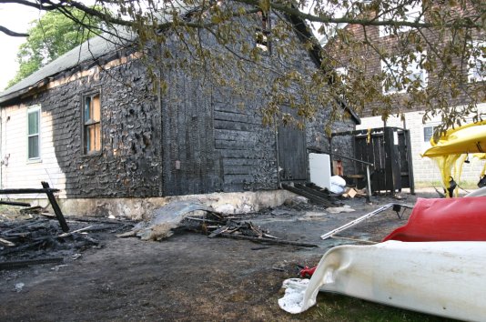 Ms. Mercer, owner of the building with her husband, said that quick work by the firefighters spared much of the building and she plans to rebuild. Photo by Jon Alden 